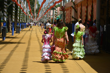 the families with the flamenco dress at Feria de Abril in Seville, Spain