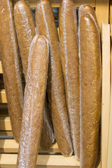 Flour products white and black bread. Bread on the counter in the store.