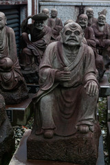Fototapeta na wymiar Small Japanese Monk Statues 