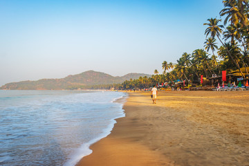 beautiful Palolem beach, Goa in india during sunrise. soft sand with water current waves 
