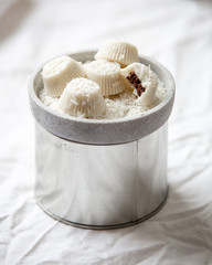 Vegan White chocolate pralines or candy with coconut