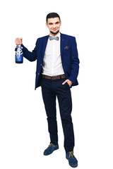 young elegant man in a blue suit with a decorated bottle of champagne or wine
