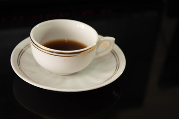 cup of coffee on the table with reflection