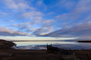 Obraz premium Reflection of a Blue Sunrise in the Water at Alviso Marina County Park