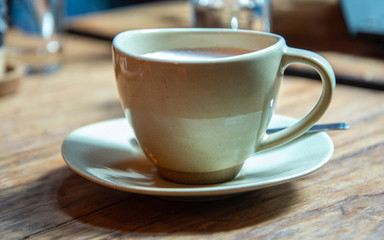 cup of coffee on wooden table