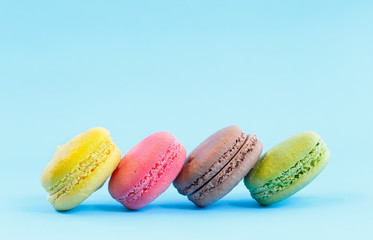 French macaron isolated on cyan
 background