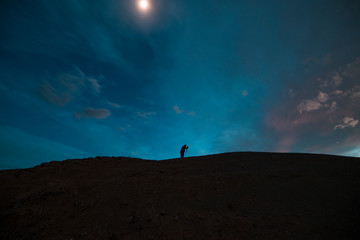 Fototapeta na wymiar Man silhouette at the moon light.