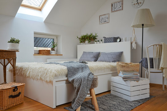Cozy white scandinavian bedroom in the attic
