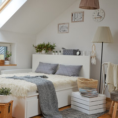Bedroom interior in scandinavian style with double room in the attic