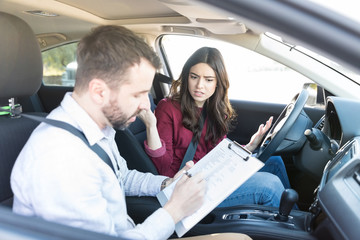 Woman Showing Disapproval In Driving Test Results