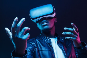 African man wearing virtual reality headset