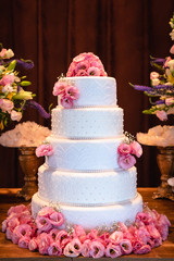 cakes decorated for social events, modern wedding cake with decorative flowers.
