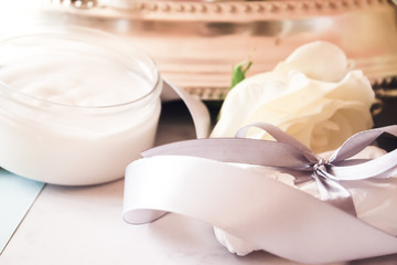 cosmetics, rose, sea salt, coconut oil, gray ribbon, white wax, gift with bow