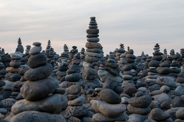 Pyramid of stoneson on the coastline , open air, different sizes