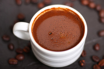 Coffee mug with coffee beans