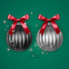 Realistic black and white christmas balls with red bow on green background, vector christmas decorations