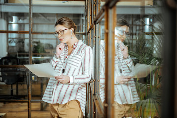 Pregnant stylish designer feeling thoughtful before presentation