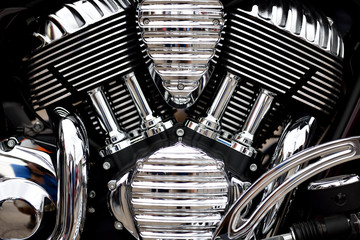 Motorcycle engine assembly with shiny chrome  and pipes