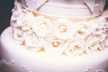 cakes decorated for social events, modern wedding cake with decorative flowers.