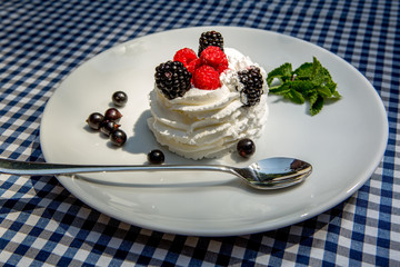 whipped cream with berries and strawberries