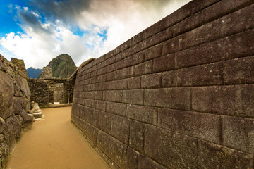 Inca carved stone wall at Machu Picchu, Peru