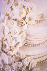 cakes decorated for social events, modern wedding cake with decorative flowers.