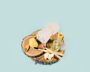 Using natural material products in home, different cosmetic products in bathroom. Minimizing ecological footprint concept. Bamboo bath towel, biodegradable bamboo toothbrush, clay mask, copy space.