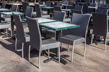 Cafe, coffee shop, tavern and restaurant concept - Empty tables in between dining hours in Europe town.