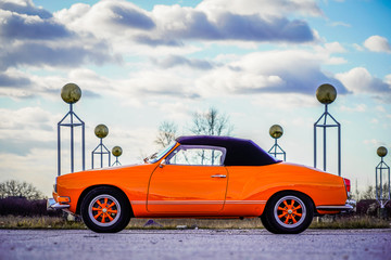 Fototapeta na wymiar Karmann Ghia orange oldtimer shown to the detail in artistic way