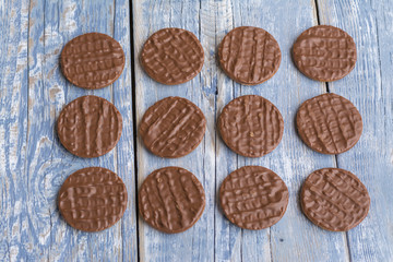 Chocolate cookies on rustic background