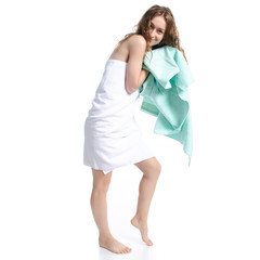 Beautiful woman in white towel wipes head beauty body care on white background isolation