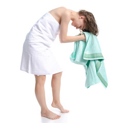 Beautiful woman in white towel wipes head beauty body care on white background isolation