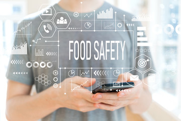 Food safety with young man using a smartphone