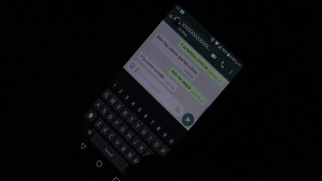 Chatting on cellphone at night in the dark