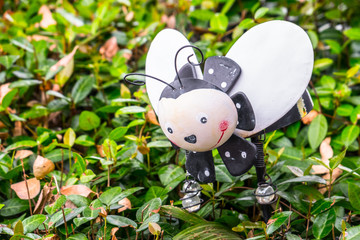 Small beautiful  bee in the flowerbed.