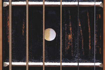 old shabby guitar neck close-up