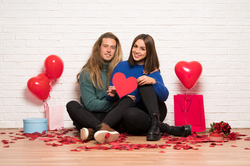 Couple in valentine day holding a heart symbol