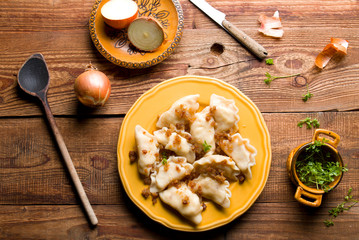 Fresh homemade dumplings on wood.