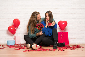 Couple in valentine day with flowers and gifts