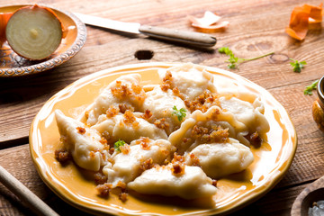 Fresh homemade dumplings on wood.