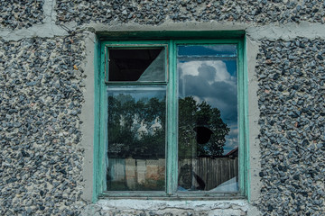 Old broken window in abandoned house