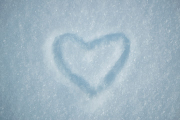 drawing of heart on snow