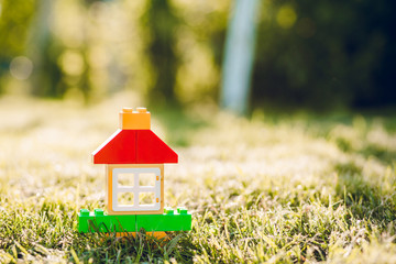 A toy house of little boy in summer garden