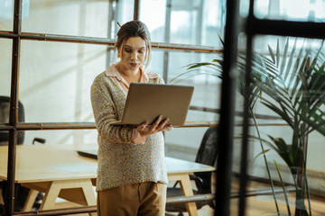 Pregnant businesswoman having video chat with her husband