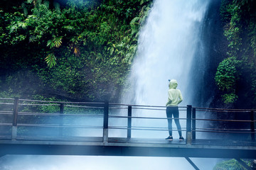 Woman enjoying Situ Gunung waterfall view