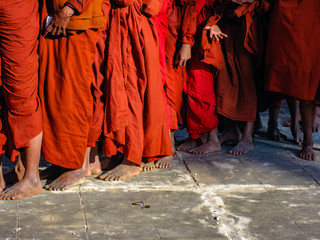 Monks waiting in a line