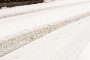 Snow in the city. Winter snow fall landscape. Street covered with snow and ice. Road in winter time. Cold concept.