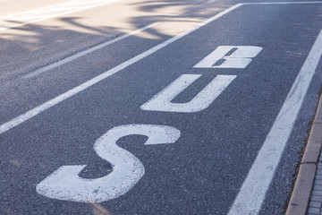 Sign on road bus, detail of a sign painted on the asphalt, information and indication signal