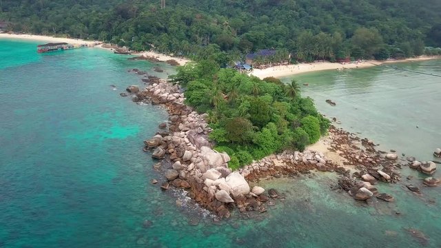 Aerial view of crystal clear waters and rocky shore at Perhentian Islands (Pulau Perhentian)