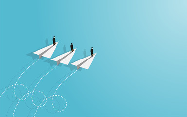 Businessman standing on paper plane